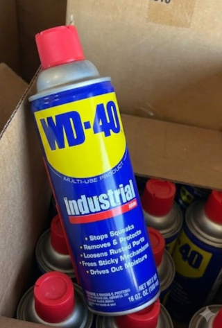 WD-40 multi-use penetrating lubricant for oilfield rust prevention, protecting plug valves, gate valves, and flowline equipment