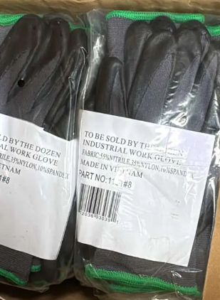 Bag of medium nitrile-dipped work gloves (#8) for oilfield PPE, providing durable hand protection for flowback and drilling operations