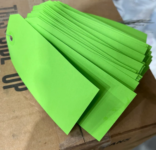 Heavy-duty green inspection tag for oilfield equipment safety, inspection, and certification marking
